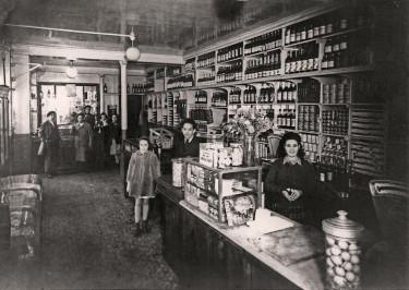 Mr. and Mrs. Messaoudi in their grocery store. 1950s, Levallois-Perret